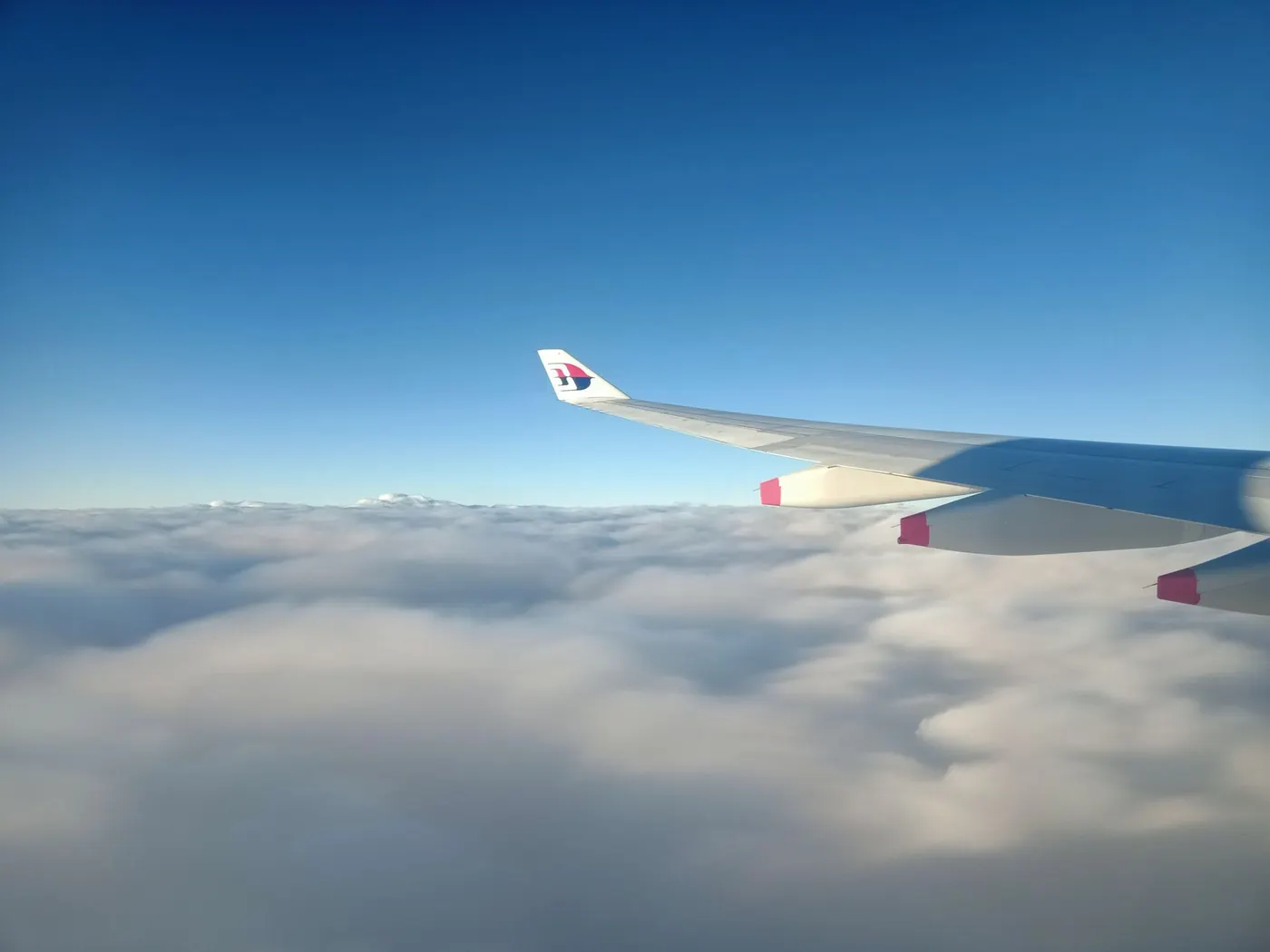 Airplane window view before flying to Malaysia