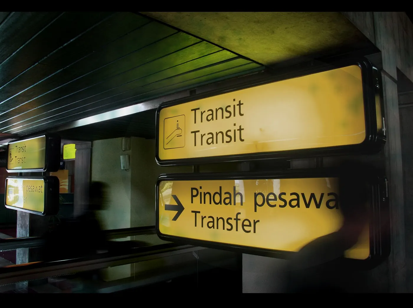 Airport transit signs for travelers connecting through Malaysia